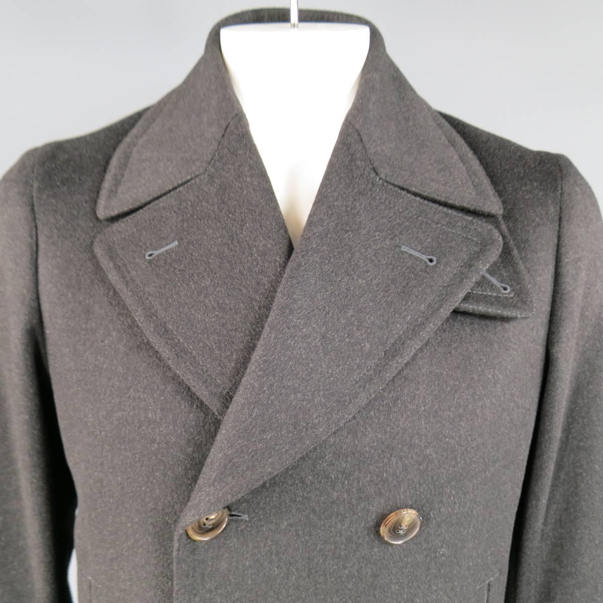 Classic double breasted peacoat by GUCCI in a soft bushed wool with pointed lapel, slit pockets, detachable storm flap collar, and epaulet cuffs. Made in Italy.
 
Excellent Pre-Owned Condition.
Marked: IT 50
 
Measurements:
 
Shoulder: 18