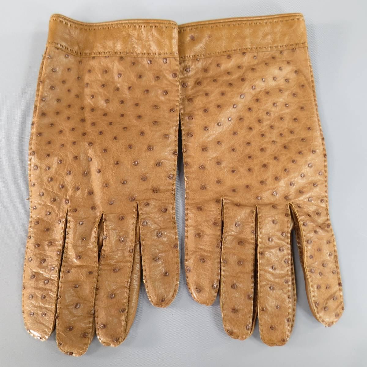 Vintage HERMES gloves in a rich caramel tan ostrich textured and smooth leather with top stitching throughout. Made in France.
 
Excellent Pre-Owned Condition..
Marked: 7 1/2
 
Measurements:
Length: 9 in.
Width: 4 in.
