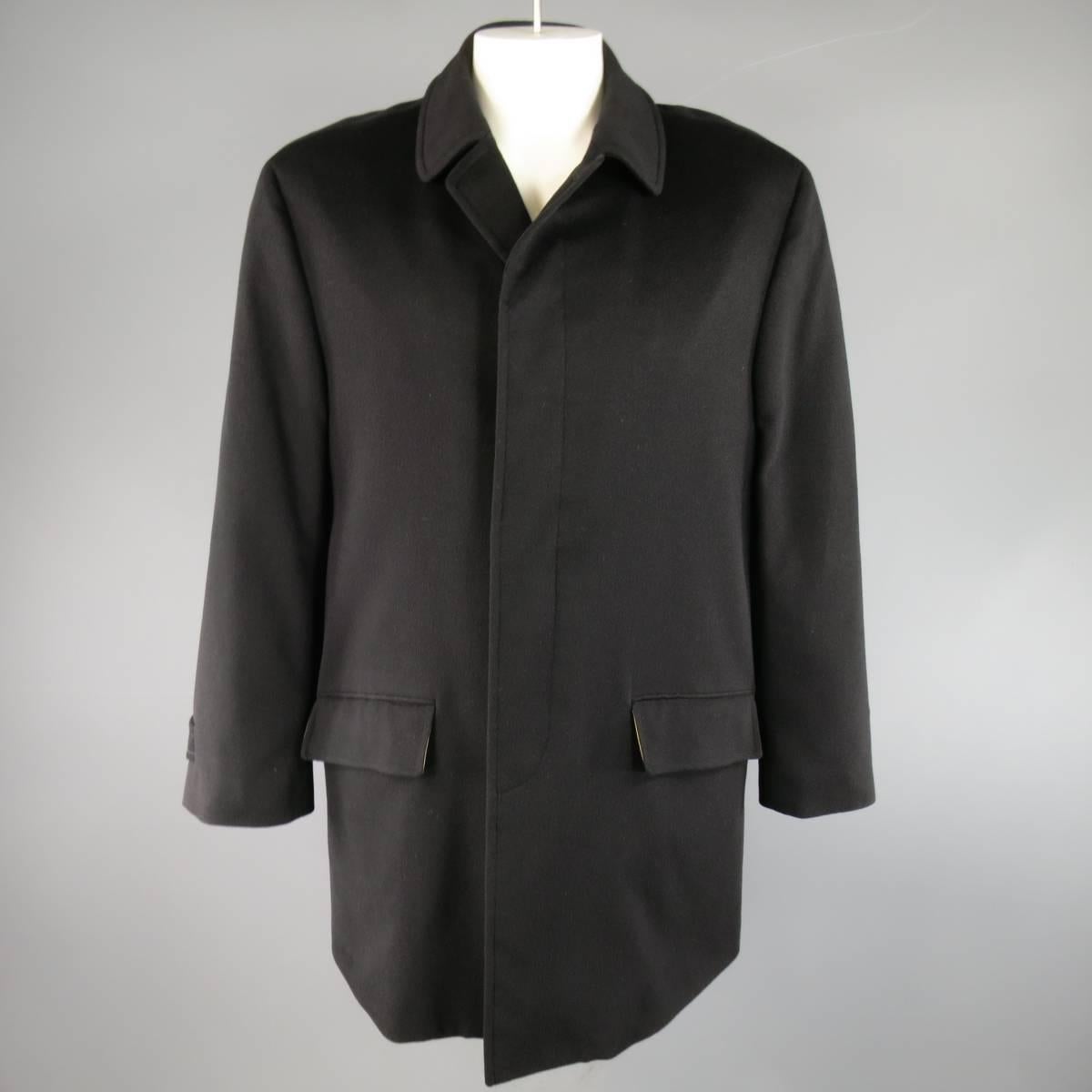 Classic LORO PIANA Storm System coat comes in back cashmere and features a pointed collar, hidden placket button closure, slanted flap pockets, and golden yellow liner. Made in Italy.
 
Excellent Pre-Owned Condition.
Marked: IT 52
