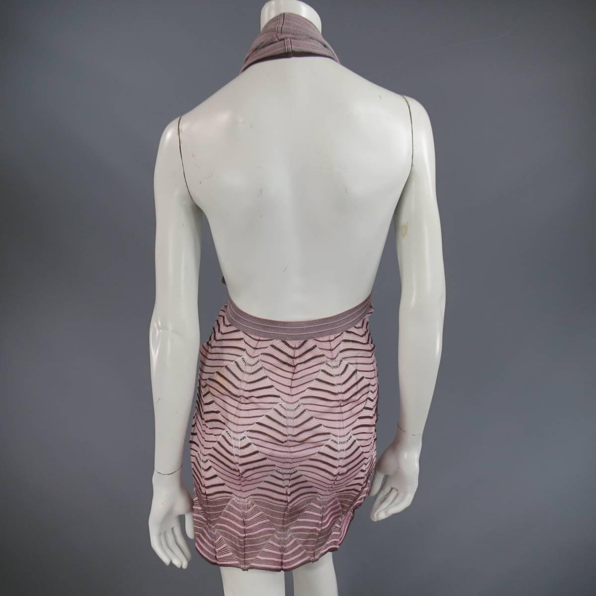 This unique MISSONI top comes in a light weight, textured pink and brown striped mesh stretch knit and features a halter with cowl neck, open back, and diamond knit pattern. Can be worn as a mini dress. Made in Italy.
Retails at $1770.00.
 
New with