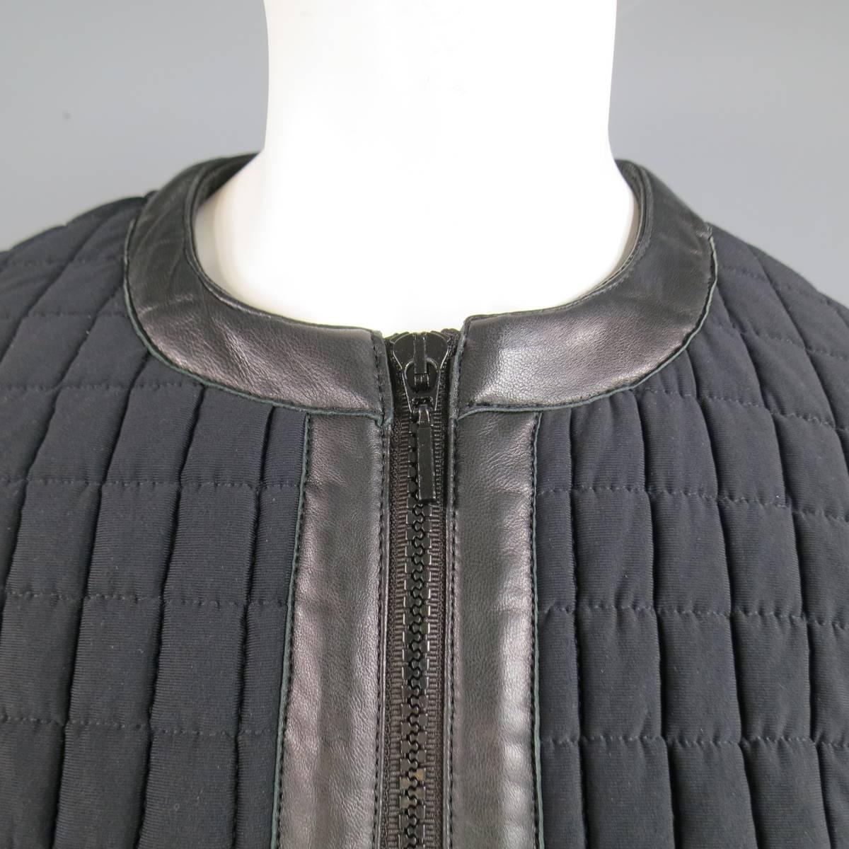 This chic PLEIN SUD cropped biker jacket comes in a soft grid windowpane quilted matte fabric and features a black double zip front. crewneck collar, double zip pockets, and leather panels throughout. Made in France.
 
Excellent Pre-Owned
