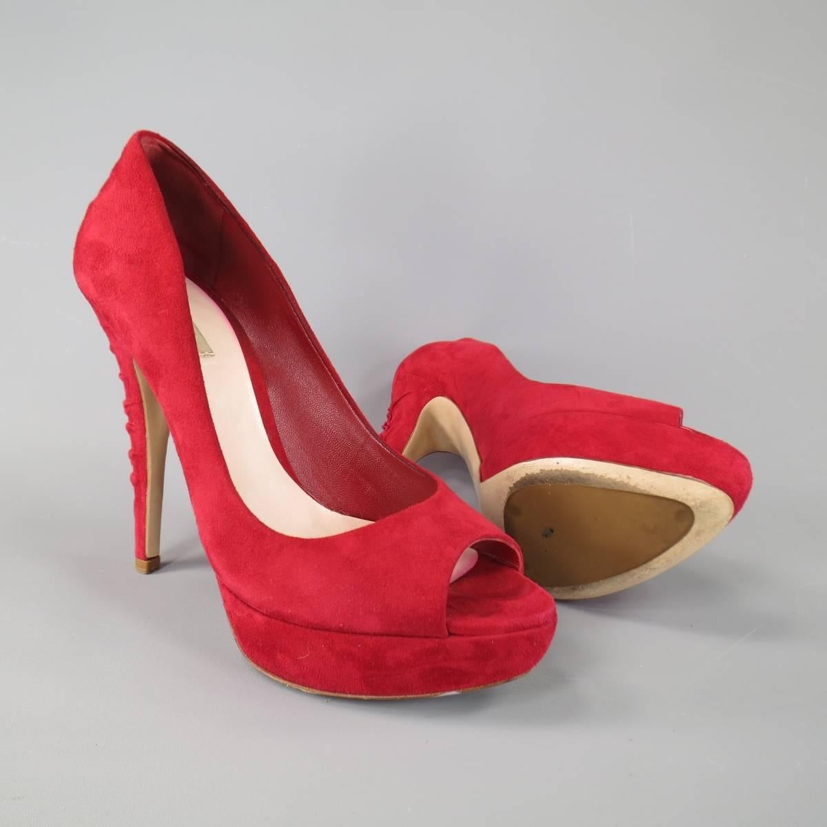 These fabulous MIU MIU pumps come in a rich red suede and feature a peep toe with platform and covered heel with gathered ruffle effect down the back. Minor wear on suede. Made in Italy. With Box.
 
Good Pre-Owned Condition.
Marked: IT 38.5
