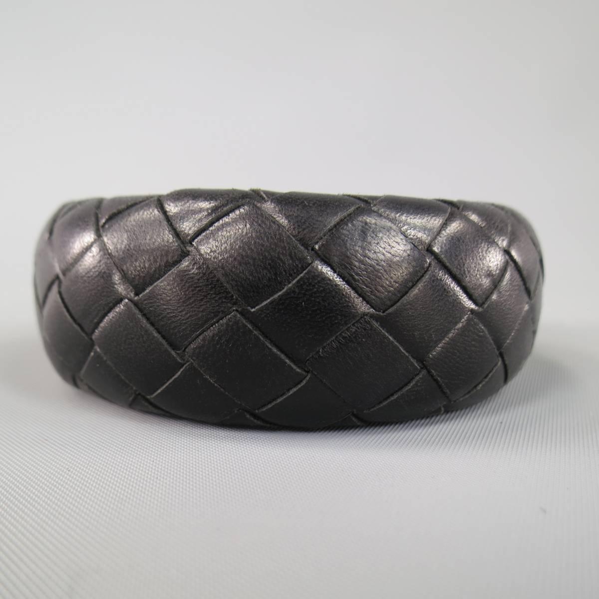 Classic Bottega Veneta bangle cuff bracelet in signature black Intrecciato woven leather. Minor wear on leather lining. As-Is. Made in Italy.
 
Good Pre-Owned Condition.
 
Fits: 7.5 in.