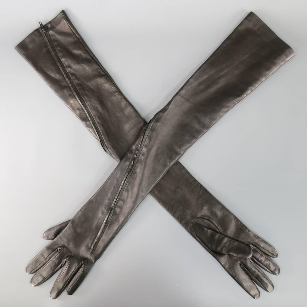 Fabulous YOHJI YAMAMOTO over the elbow length opera gloves in a soft black smooth sheep skin leather with full zip around closure from the arm to the knuckle. Made in Italy.
 
Excellent Pre-Owned Condition.
Marked: Size 6.5 (FZ-W54-739)
