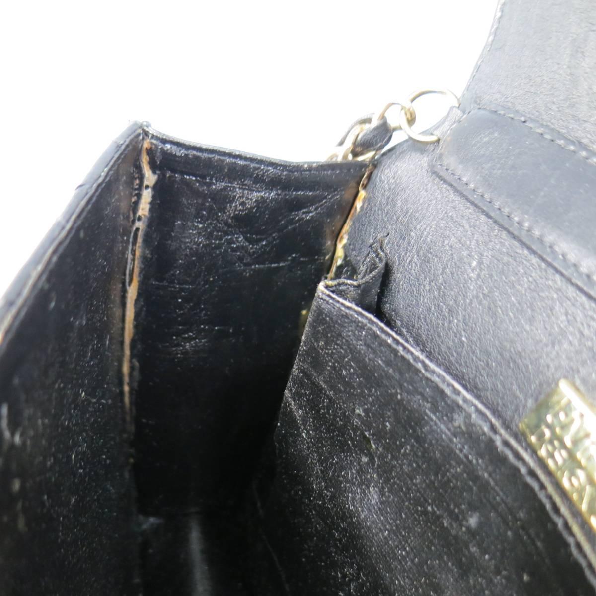 black quilted purse with gold chain strap