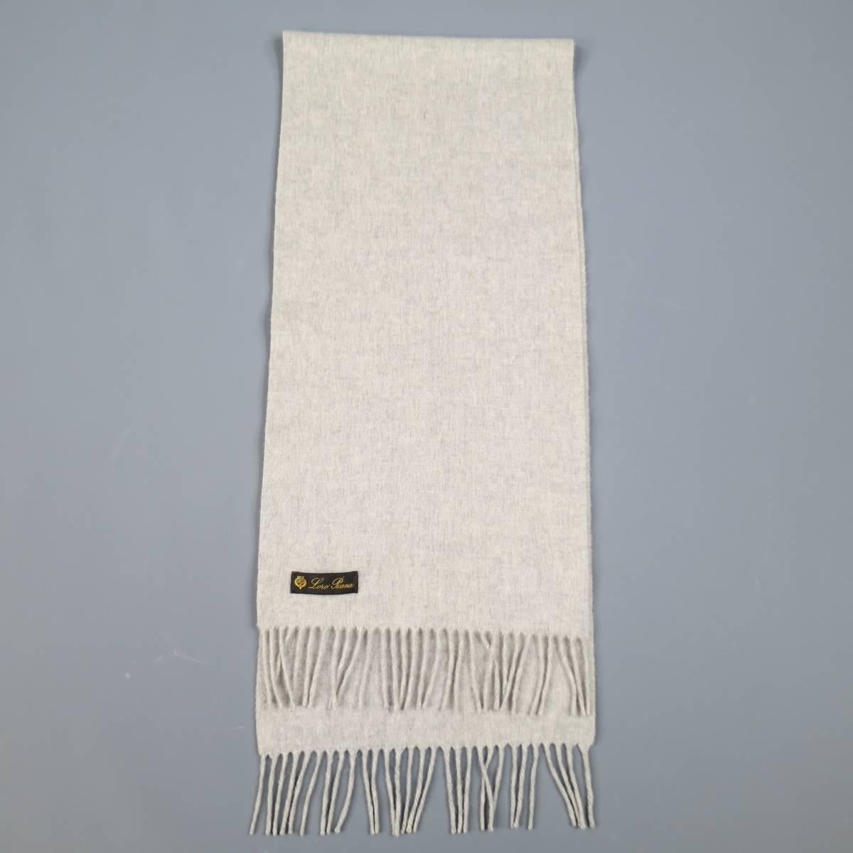 LORO PIANA scarf consists of cashmere material in a light grey color tone. Designed in a heather pattern with fringe detailing. Made in Italy.
Retails at $450.00.

Excellent Pre-Owned Condition
 
Measurements:
 
Width: 12.5 in.
Length: 55 in.