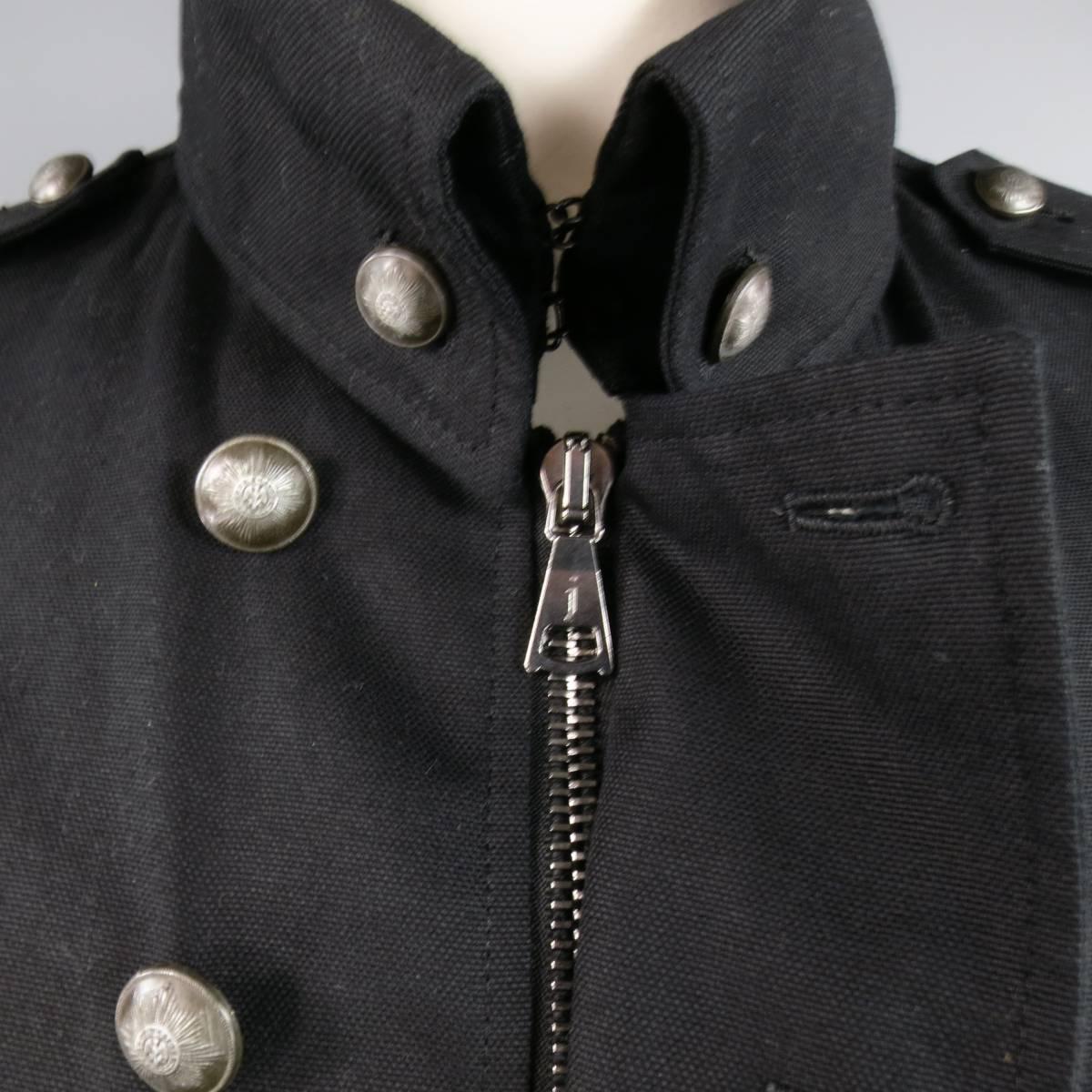 Modern miltary jacket by JOHN VARVATOS in black cotton canvas featuring a pointed collar with buttons, shoulder epaulets, double zip pockets, tab cuffs, and double breasted closure with brass buttons. Made in Italy.
Retails at $1195.00.
 
New with