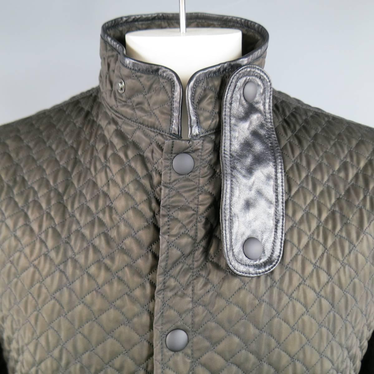 This unique BOTTEGA VENETA jacket comes in a quilted brown nylon twill and features a high collar with leather snap tab, double zip patch pockets, leather piping throughout, and back zip vents. Made in Italy.
 
New with Tags.
Marked: IT 54
