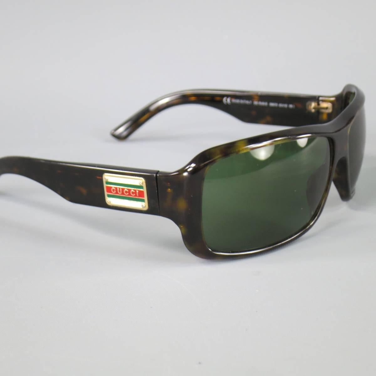 Vintage GUCCI sunglasses in a dark brown tortoiseshell acetate featuring a square green lens and thick arms with gold retro Gucci logo. Minor wear. As-Is. Made in Italy.
 
Fair Pre-Owned Condition.
Marked: 1548 08670 63 12 115/
 
63 x 12 x 115 mm
