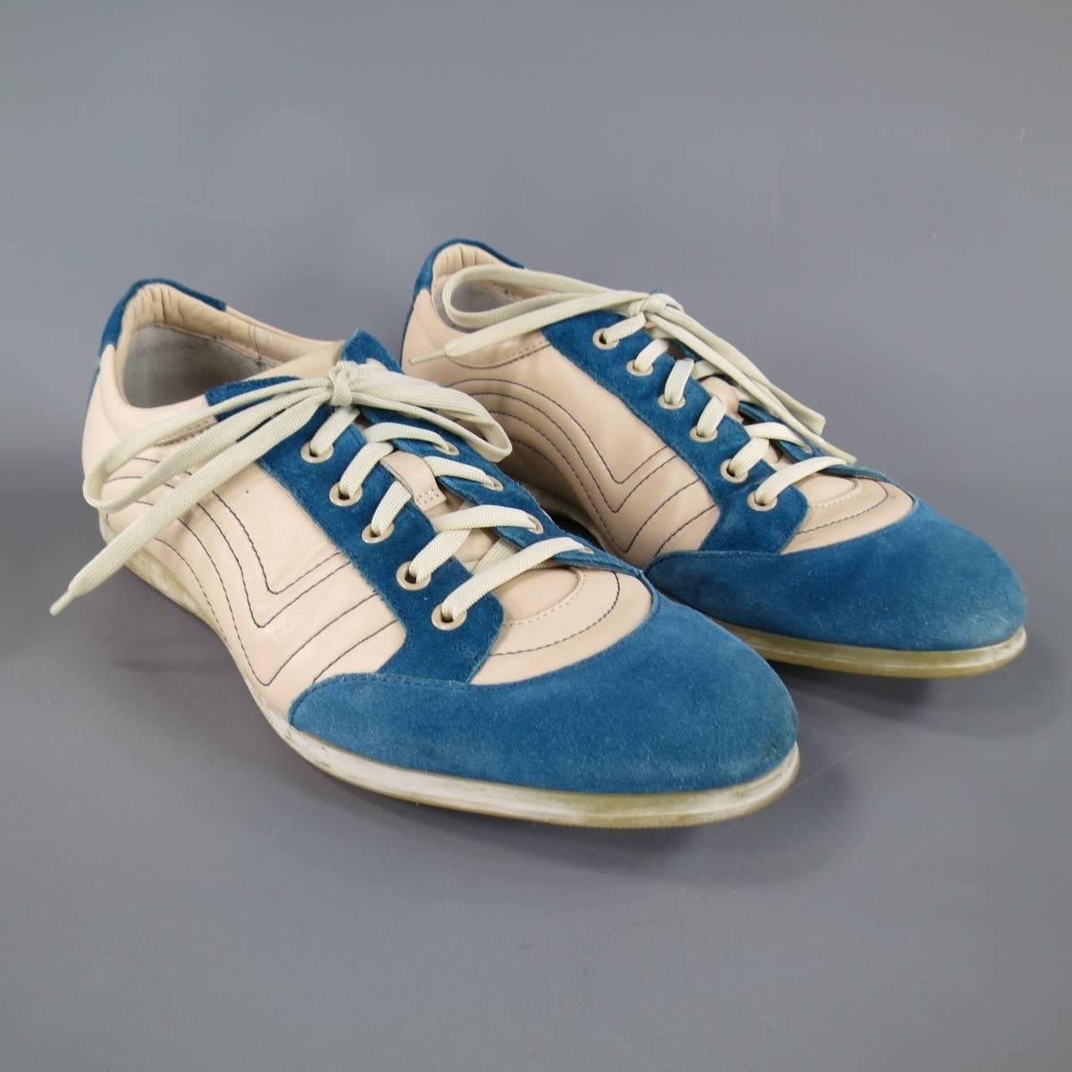 SALVATORE FERRAGAMO Sneakers consists of leather material in a cream and blue color tone. Designed in a round toe, suede trim with contrast stitching along sides. Distress rubber sole. Made in Italy. 

Good Pre-Owned Condition
Marked Size: EE 7
