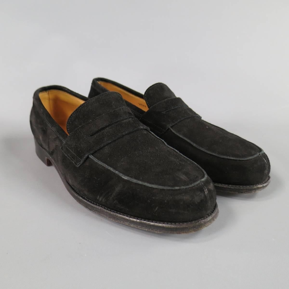 JOHN LOBB "Campus" Loafers consists of suede material in a black color tone. Designed in a round toe seam front, penny loafer vamp and tone-on-tone stitching. Dark leather sole. Made in Italy.
 
Good Pre-Owned Condition 
Marked Size: 7 1/2