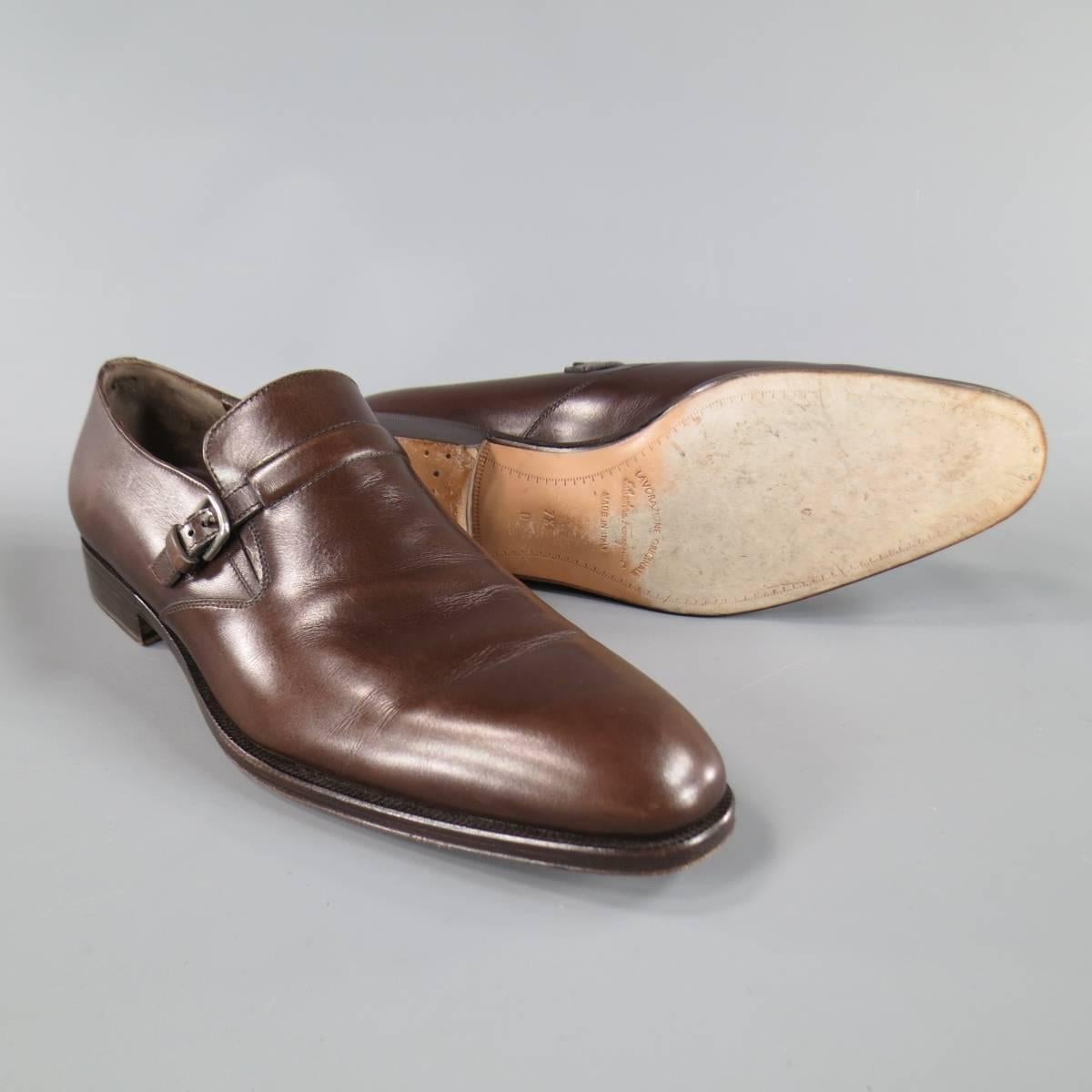SALVATORE FERRAGAMO Loafers consists of leather material in a brown color tone. Designed in a round toe front, single monk strap with silver buckle. Detailed with tone-on-tone stitching and brown leather sole. Made in Italy.

 
Excellent Pre-Owned