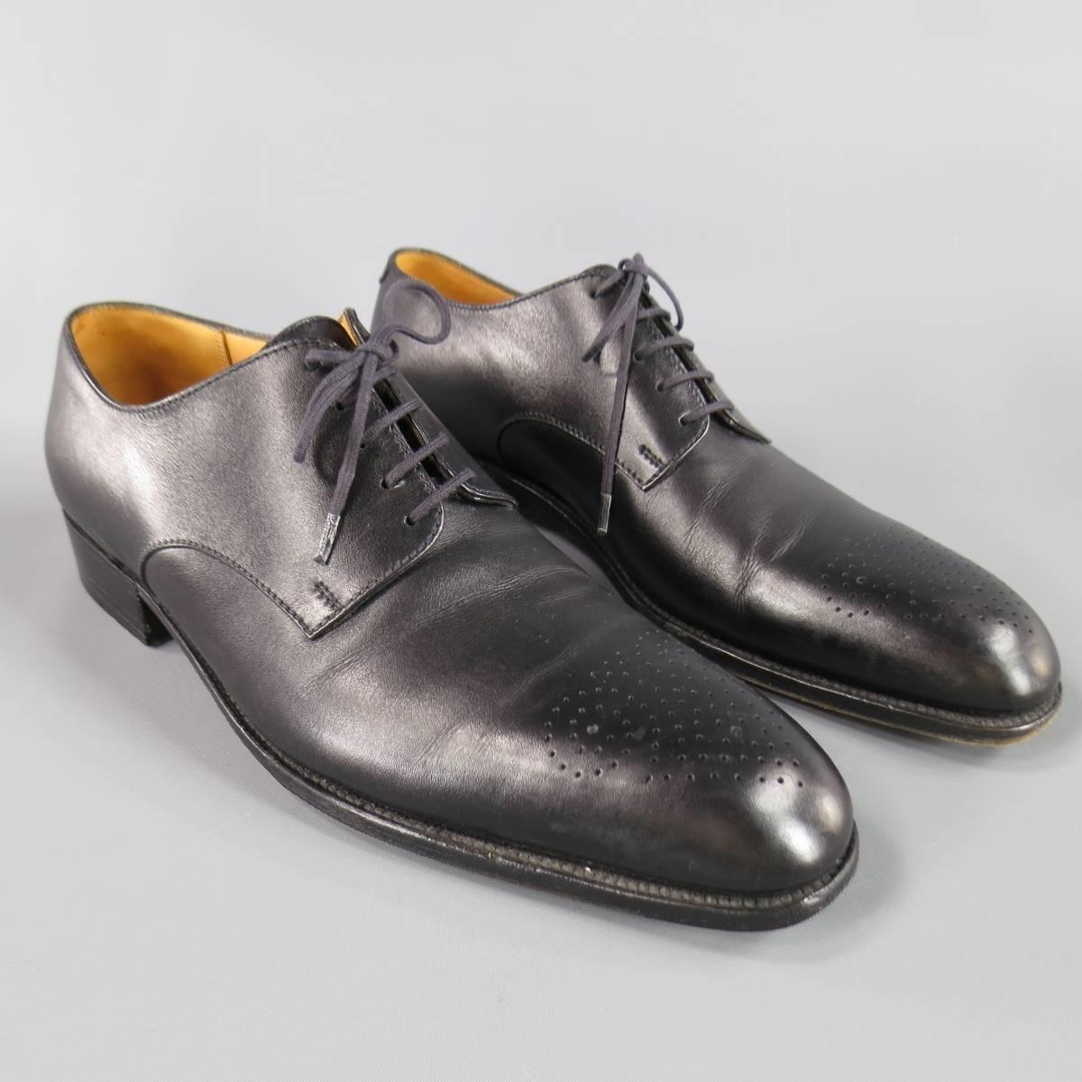 J.M. WESTON Lace-Up Shoes consists of leather material in a burgundy color tone. Designed in a round, perforated wingtip front and same tone laces. Detailed with black leather sole with heel. Comes with original box and shoe tree's. Made in