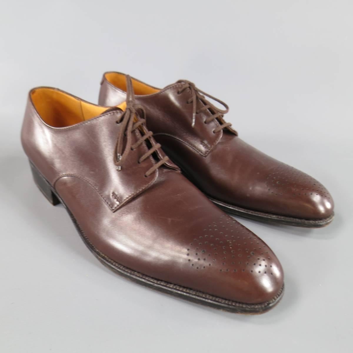 J.M. WESTON Lace-Up Shoes consists of leather material in a burgundy color tone. Designed in a round, perforated wingtip front and same tone laces. Detailed with black leather sole with heel. Comes with original box. Made in Italy.
 
Excellent