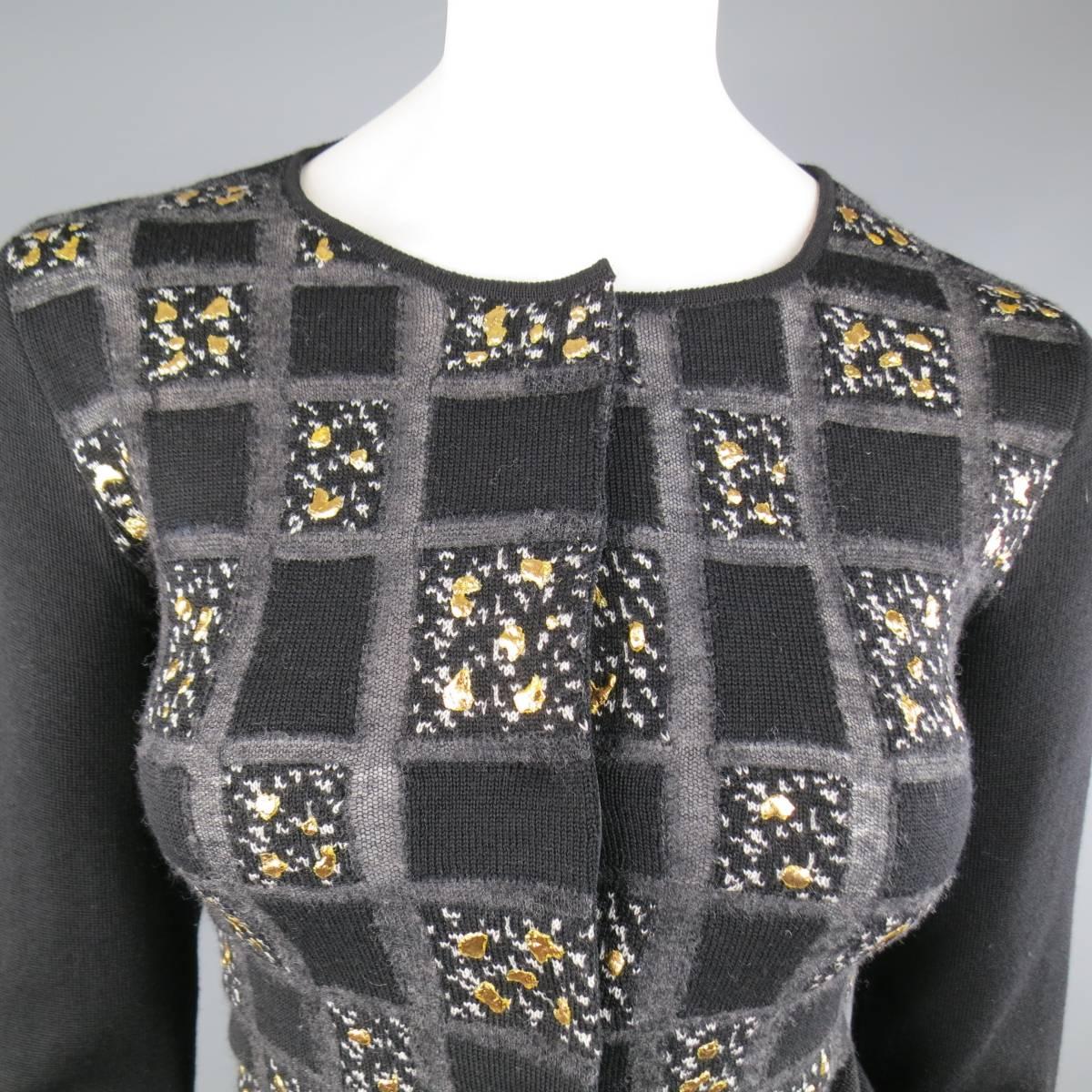 Cropped GIAMBATTISTA VALLI cardigan in a unique black wool knit with sheer charcoal grid pattern featuring a crew neck, hidden placket snap closure with ribbon lining, and  metallic gold splatter texture throughout. Made in Italy.
 
Excellent