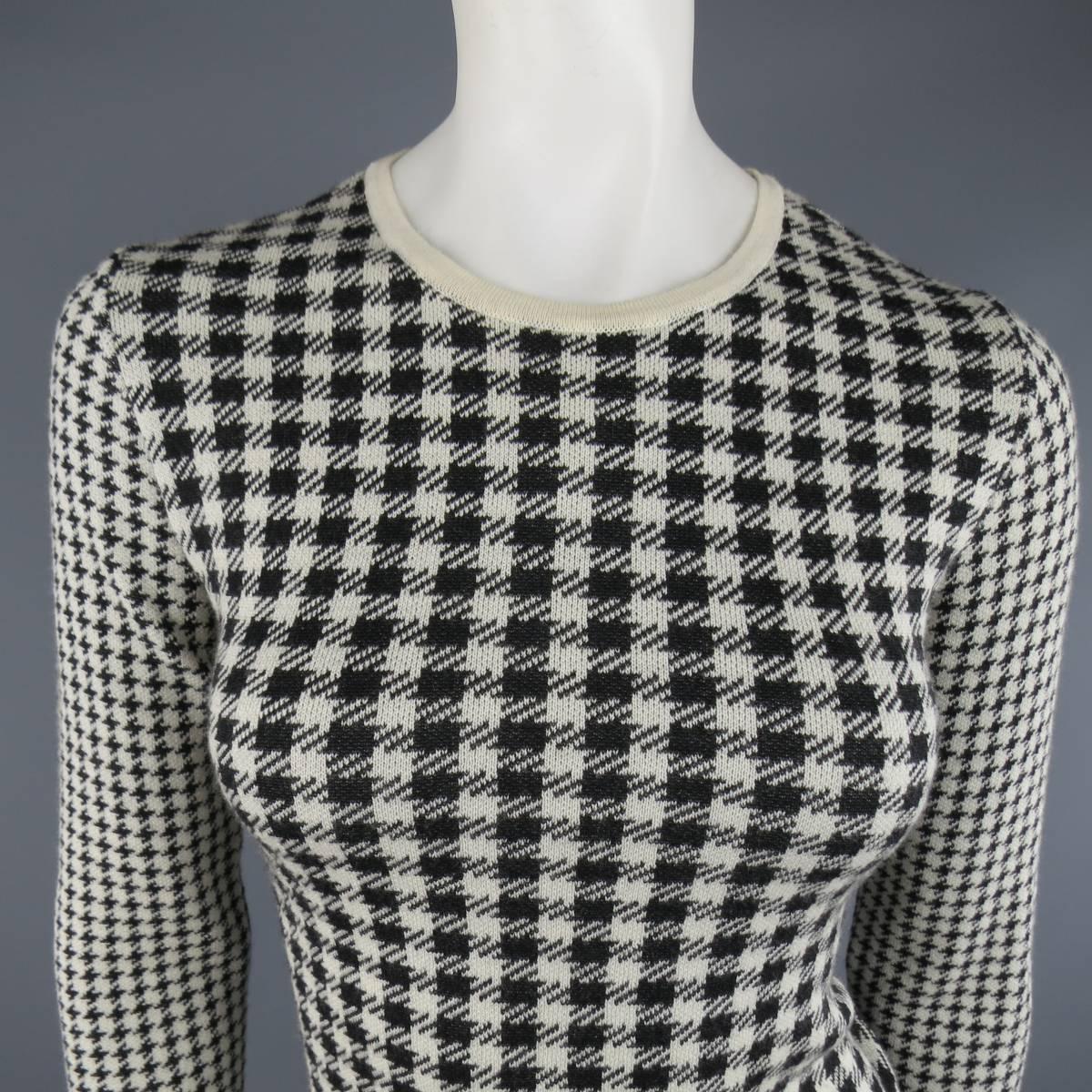 Vintage YOHJI YAMAMOTO pullover sweater in a cream & black houndstooth print wool featuring a crewneck and contrast printed sleeves. Made in Japan.
 
Excellent Pre-Owned Condition.
Marked: JP 3
 
Measurements:
 
Shoulder: 15 in.
Bust: 39 in.
Sleeve: