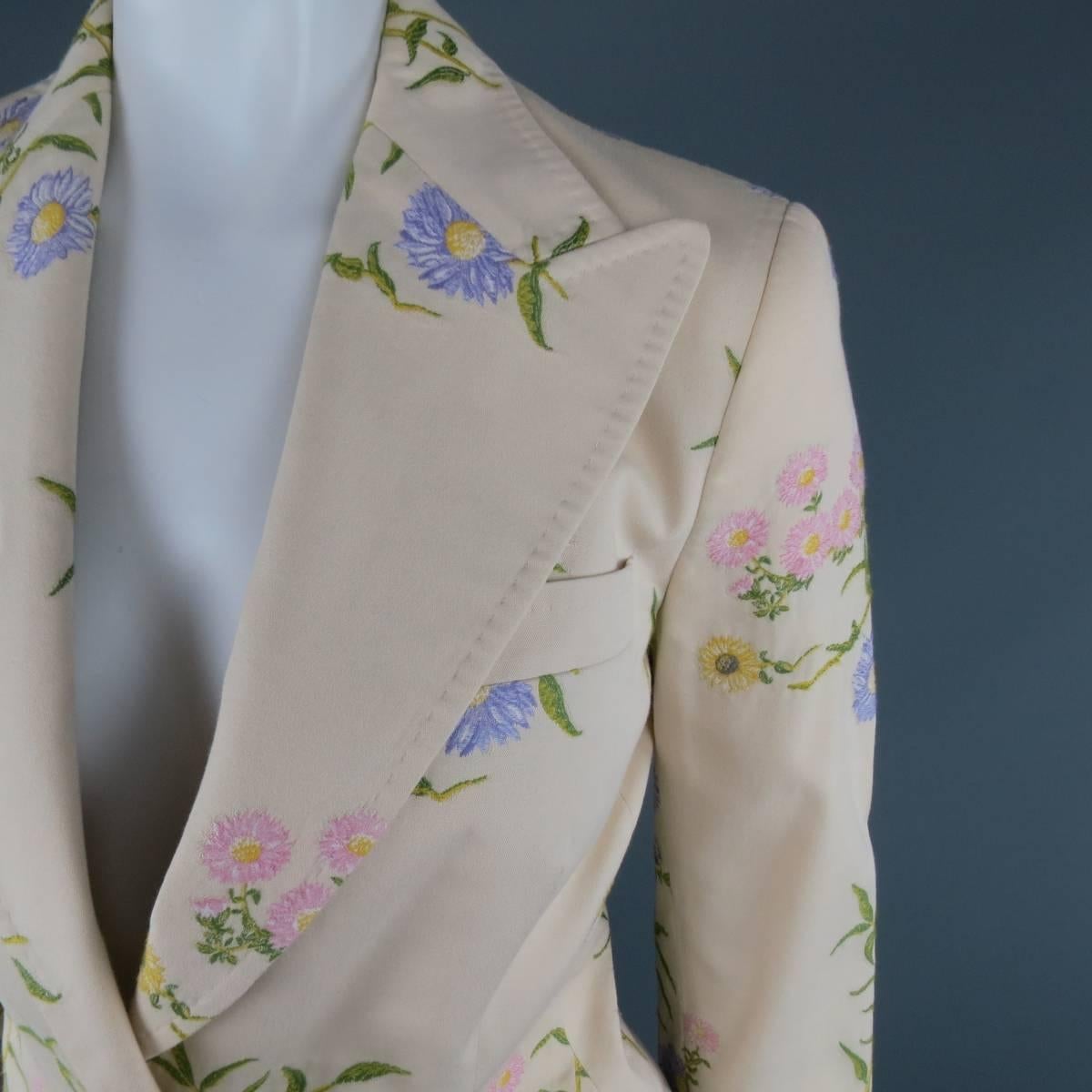 DOLCE & GABBANA blazer in a khaki beige cotton blend with all over pink, purple, and yellow daisy floral embroidered print throughout featuring a wide peak lapel with top stitching, simulated flap pockets, and dark silver tone engraved buttons with