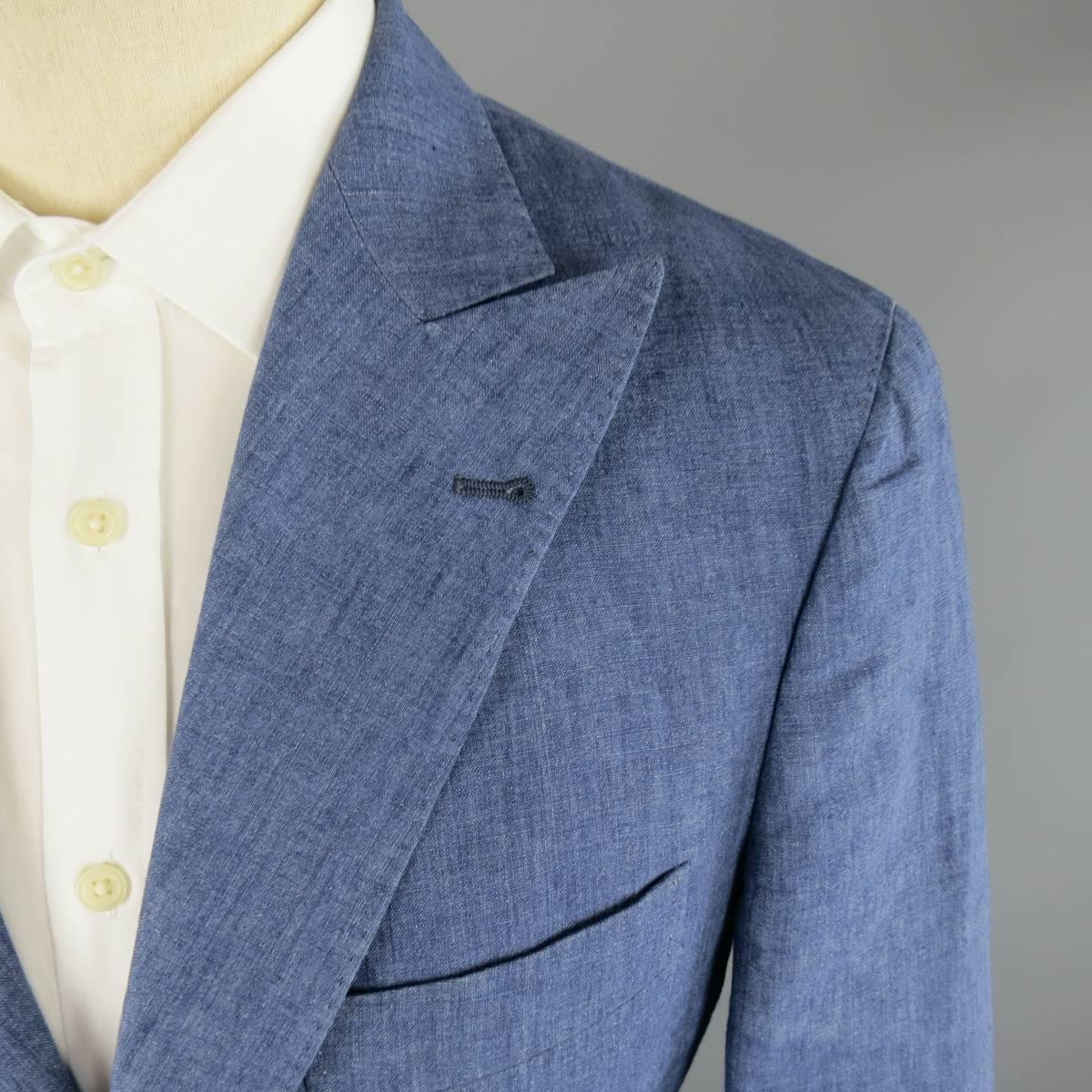 BRUNELLO CUCINELLI Sport Coat consists of linen material in a blue color tone. Designed in a 3 button front, peak lapel collar and 4 button cuff sleeves. Detailed with a top pocket square and bottom patch pockets. Double back vent with half