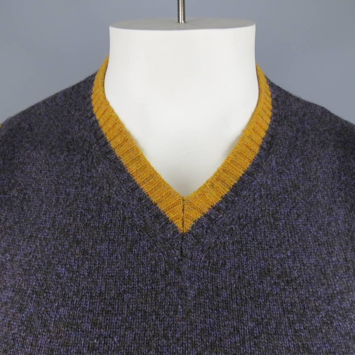 ETRO Vest consists of merino wool material in a purple color tone. Designed in a v-neck collar, color blocked with mustard (gold) accents. Detailed in a heather pattern. Made in Italy.
 
Excellent Pre-Owned Condition
Marked Size: M
 
Measurements
