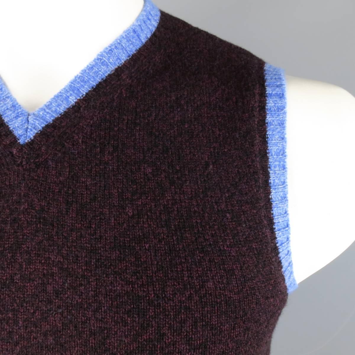 ETRO Vest consists of merino wool material in a burgundy color tone. Designed in a v-neck collar, color blocked with blue accents. Detailed in a heather pattern. Made in Italy.
 
Excellent Pre-Owned Condition
Marked Size: M
 
Measurements
