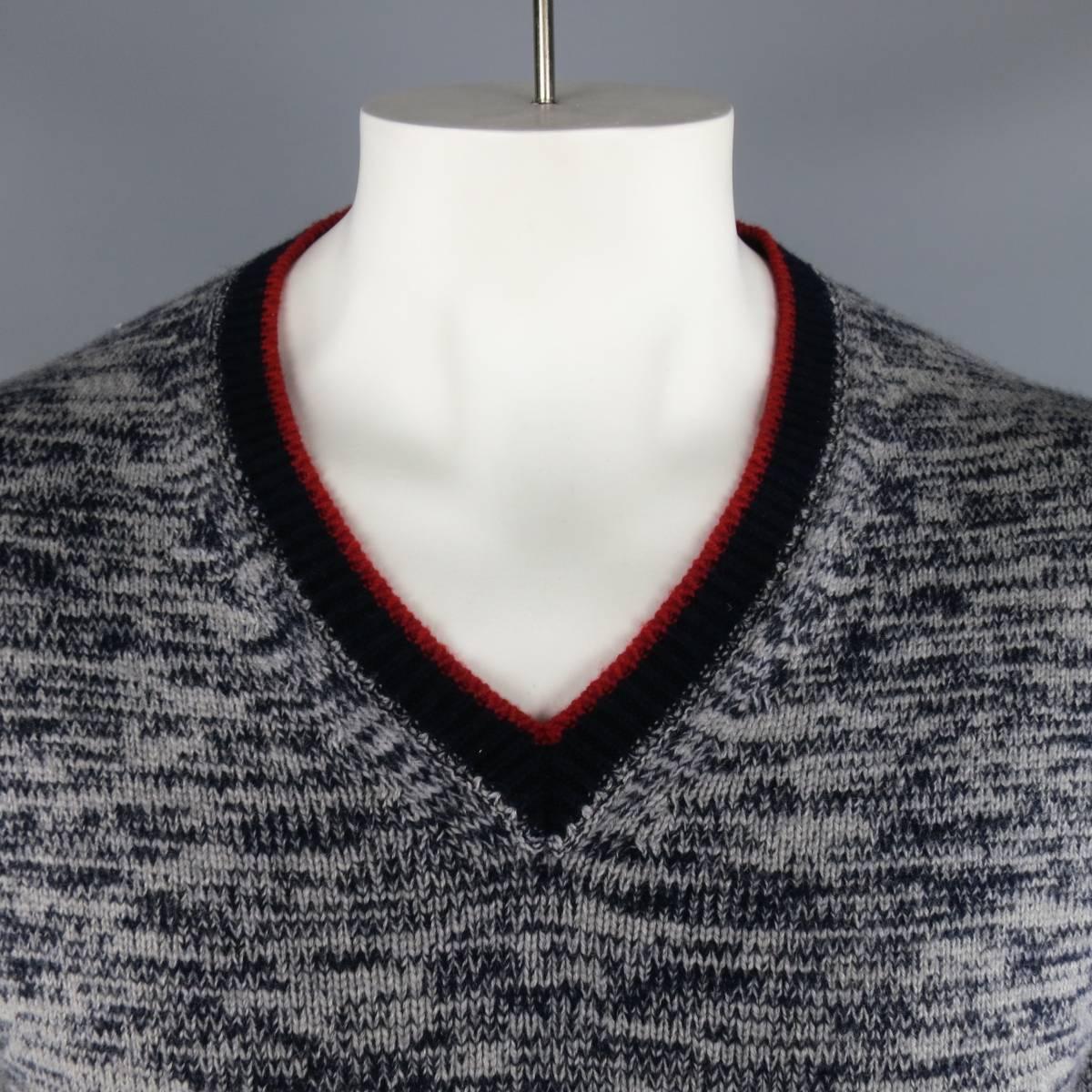 grey sweater with red stripe