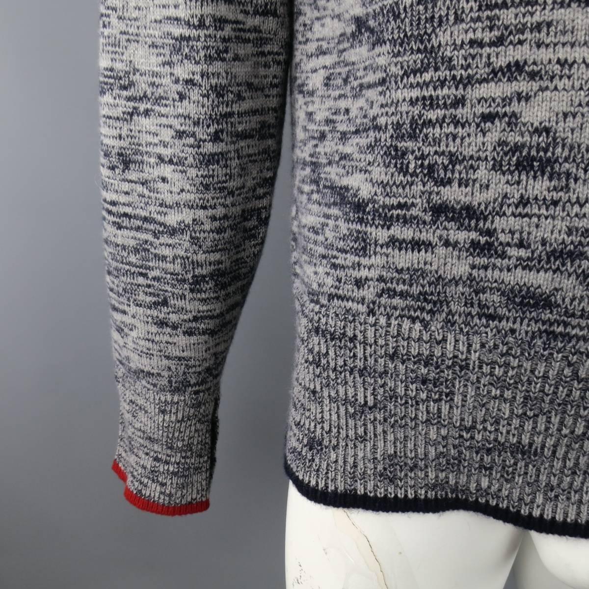 BLACK FLEECE Sweater consists of cashmere material in a grey color tone. Designed in a v-neck collar, rib button cuffs and hem. Detailed heather pattern with navy and red accents. Made in Scotland.
 
Excellent Pre-Owned Condition
Marked Size: BB4
 
