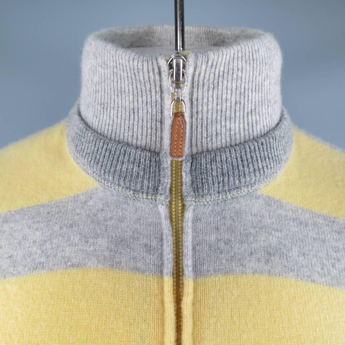 BRUNELLO CUCINELLI Cardigan consists of 100% cashmere material in a grey and yellow. Designed with a zip-up front, double collar and multi-color stripe pattern. Detailed rib cuffs and hem. Made in Italy.
 
Excellent Pre-Owned Condition 
Marked Size: