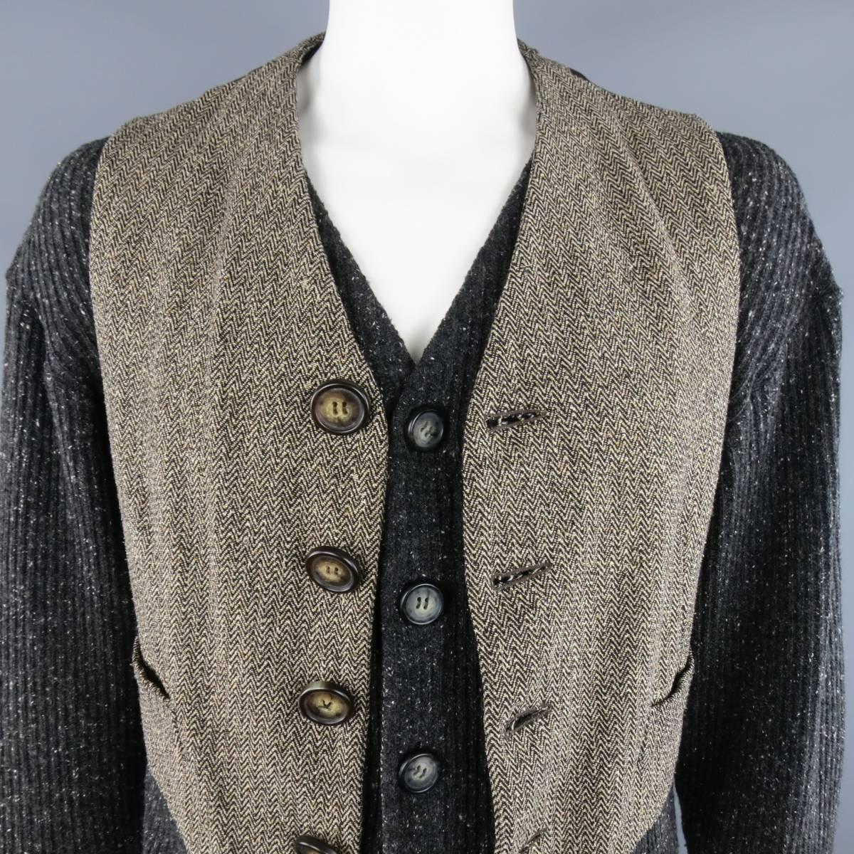 DOLCE & GABBANA Vest consists of wool/ silk material in a dark gray color tone. Designed in a long sleeve with attached vest. Herringbone pattern in a brown tone and heather grey sleeves. Detailed with suede brown elbow patches. Made in Italy.
