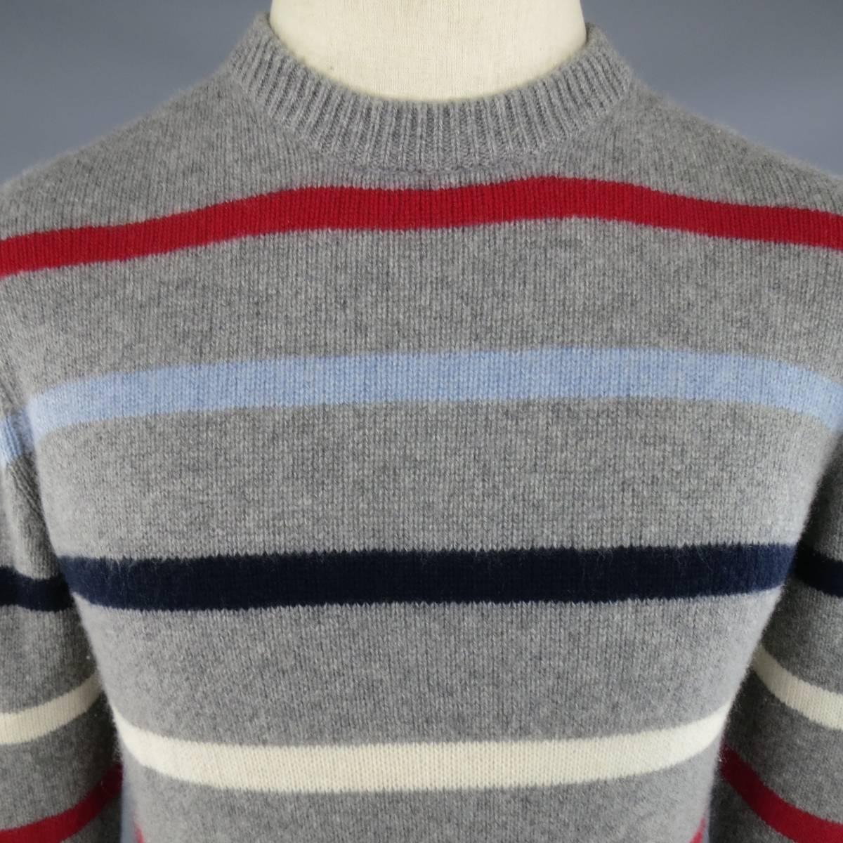 MICHAEL BASTIAN Pullover consists 100% cashmere material in a grey color tone. Designed in a crew-neck collar, rib cuffs and hem. Detailed with multi-color stripes in red, navy, light blue and white. Made in Italy.
 
Excellent Pre-Owned