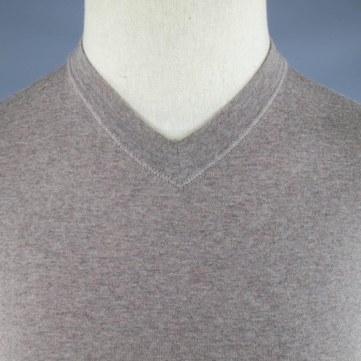 BRAND NEW JIL SANDER Pullover consists of wool material in a oatmeal color tone. Designed in a v-neck collar, heather pattern and tone-on-tone stitching. Comes with original tags. Made in Italy.
 
New Pre-Owned Condition 
Marked Size: 48
