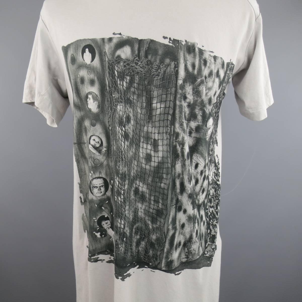 COMME DES GARCONS Short Sleeve Shirt consists of 100% cotton material in a grey color tone. Designed with a crew-neck collar, elongated silhouette, and graphic print by artist Roger Ballen. Autumn Winter 2015 Collection. Made in Japan.
 
Excellent