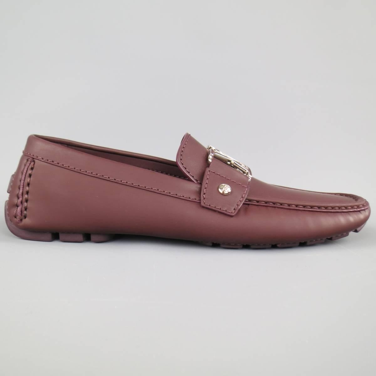 LOUIS VUITTON Monte Carlo loafers in a prune brown rubberized leather featuring a driver sole, apron toe, and silver and brown enamel LV logo pendant. Made in Italy.
 
Brand New. Retails at $650.00.
Marked: 5 M
 
Outsole: 11 x 4 in.