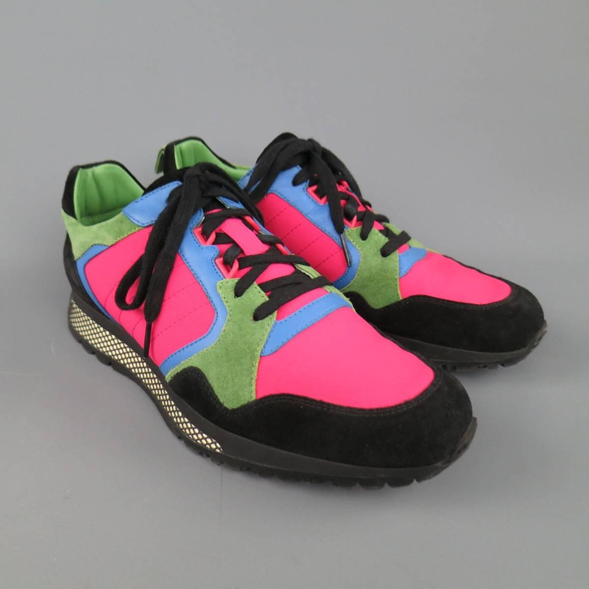 Gucci trainers in a vibrant neon pink nylon featuring a black suede toe and heel, panels of green suede and blue leather, and trainer sole with fishnet overlay. Made in Italy.
 
Excellent Pre-Owned Condition.
Marked: UK 9
 
Outsole: 12 x 4 in.
