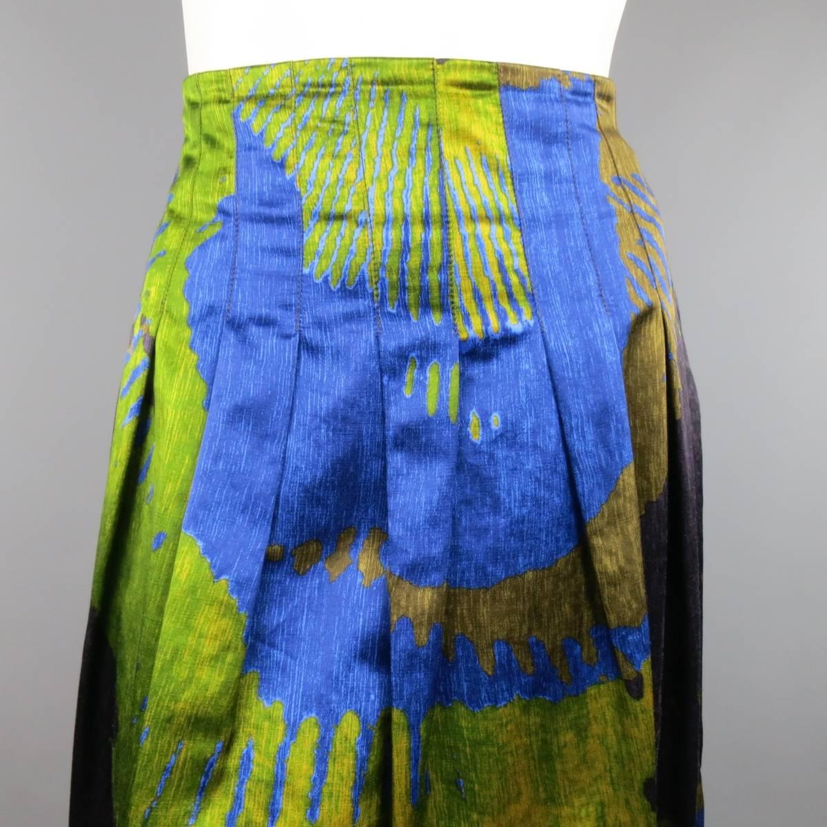 ETRO multi-colored blue, green, yellow, and plum A-line skirt in an abstract print. Featuring a cotton/viscose satin blend and fully lined in rayon/acetate with side zipper closure. Made in Italy.
 
Excellent Pre-Owned Condition. Retails at