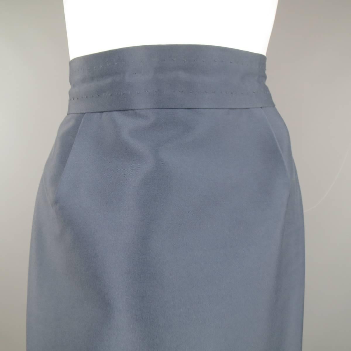 MARC JACOBS A-line skirt features a nylon/silk blend satin in a slate blue color. Fully lined with zip and hook and eye closure. Made in USA.
 
Excellent Pre-Owned Condition.
Marked: 4
 
Measurements:
 
Waste: 28 In.
Hip: 38 In.
Length: 25 In.
