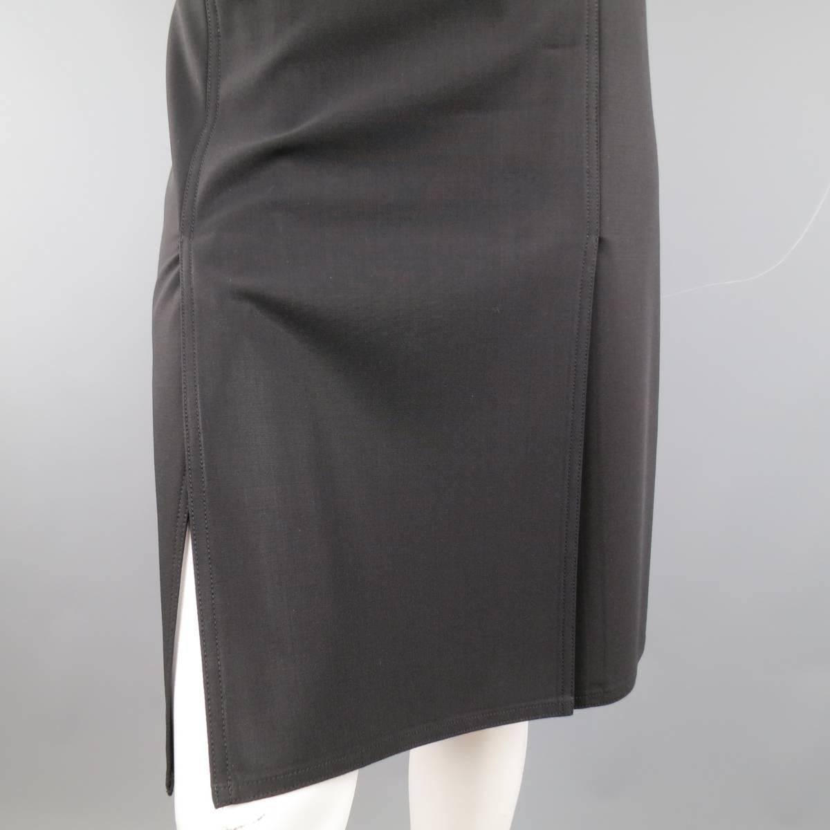 CELINE pencil skirt in a hick wool fabric featuring double symmetrical slits on front and back. Made in France.
 
Excellent Pre-Owned Condition.
Marked: 38
 
Measurements
Hips: 30 In.
Waste: 36 In.
Length: 23 In.
