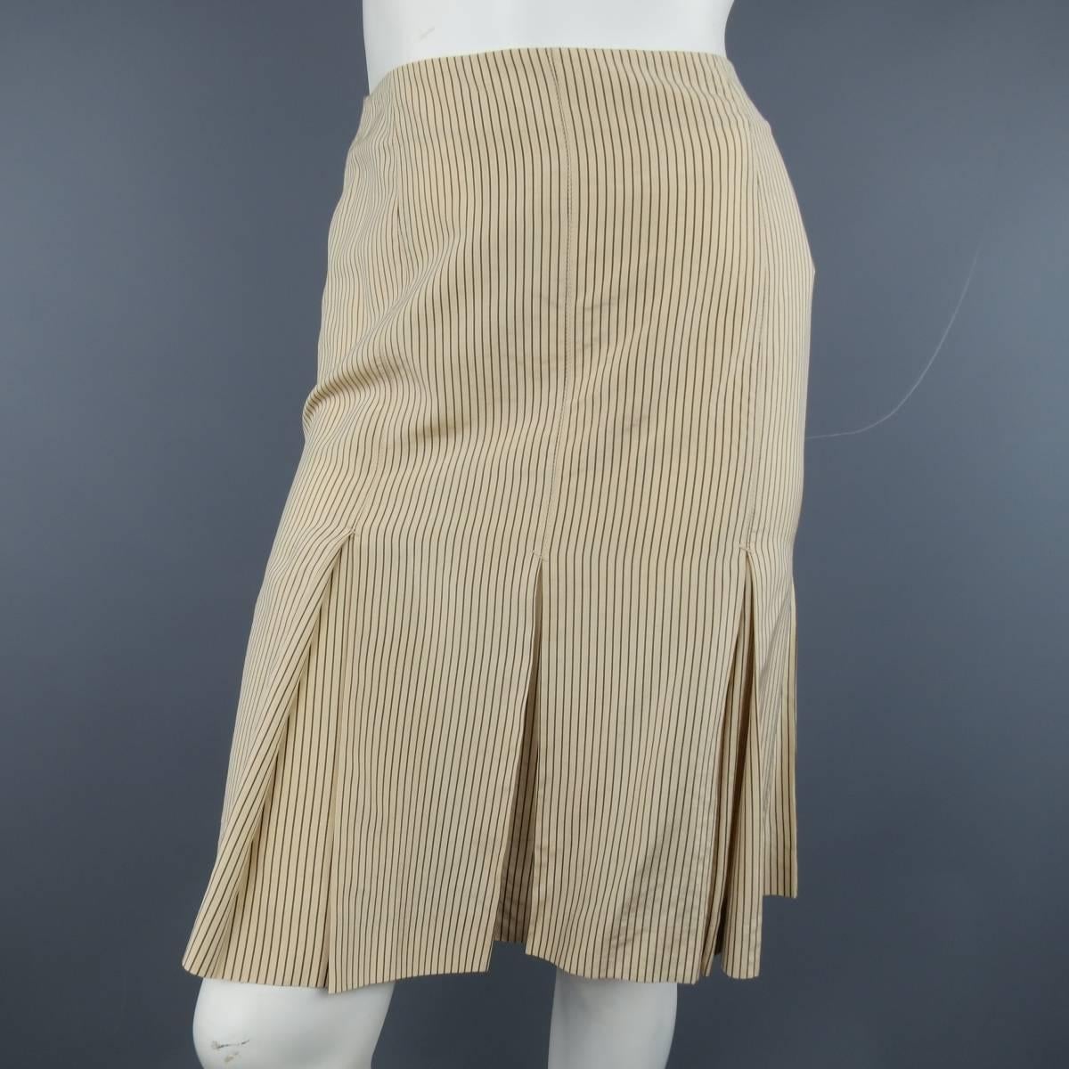 JEAN PAUL GAULTIER skirt in a peachy beige silk  rayon blend with brown pinstripe print in a pencil silhouette with box pleated hem and signature back tab. Made in Italy.
 
Excellent Pre-Owned Condition.
Marked: 6 USA
 
Measurements:
 
Waste: 28