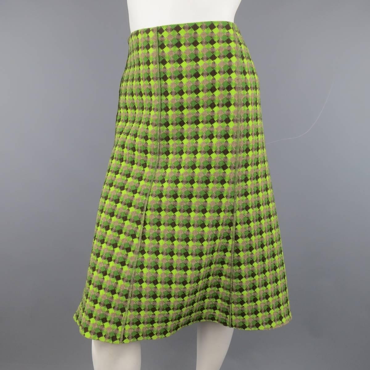 AKRIS A-line skirt flare skirt in a thick green diamond pattern tweed knit with accents of brown and taupe with exposed stitching. Fully lined. Made in Switzerland.
 
Excellent Pre-Owned Condition. Retails at $495.00.
Marked: 8 USA
 
Measurements:
