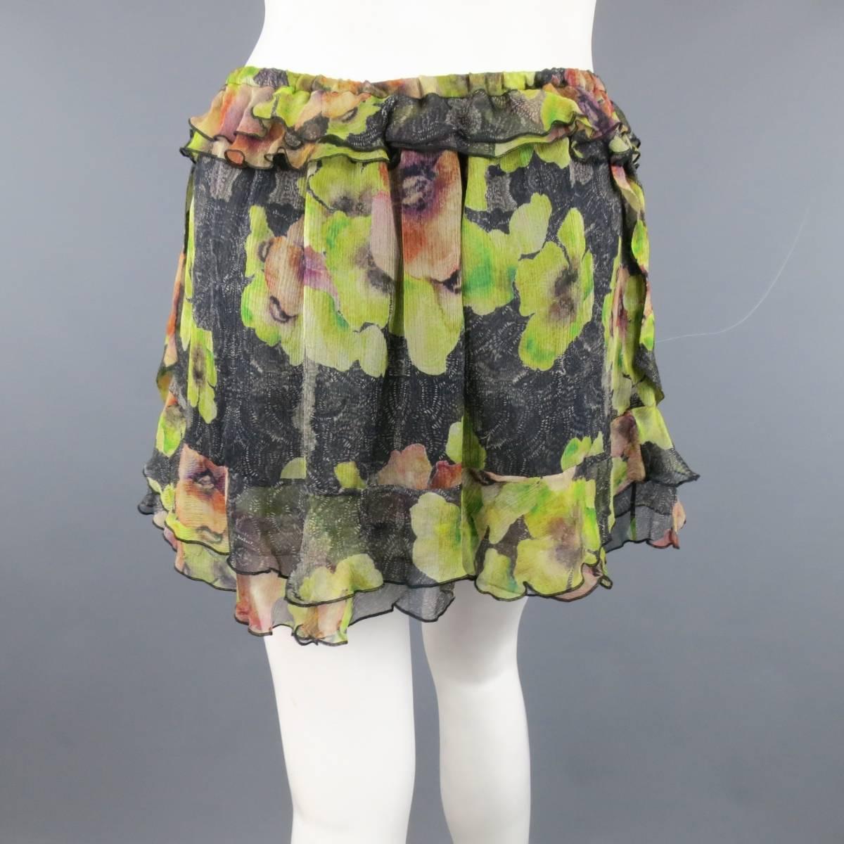 ISABEL MARANT mini skirt in a light weight black and green floral print silk chiffon featuring an elastic waistband, and cascading ruffled layers. Made in Poland.
 
New with Tags. Retails at $750.00.
Marked: IT 40
 
Measurements:
 
Waist: 27