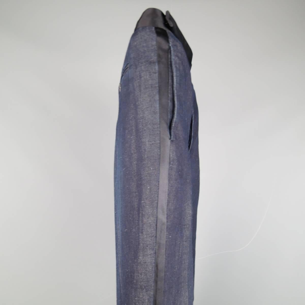 MASON MARTIN MARGIELA trousers in a classic deep indigo blue denim featuring black satin tuxedo stripes and waistband.  Made in Italy.
 
Excellent Pre-Owned Condition.
Marked: IT 50
 
Measurements:
 
Waist: 35 in.
Rise: 11 in.
Inseam:  32 in.
