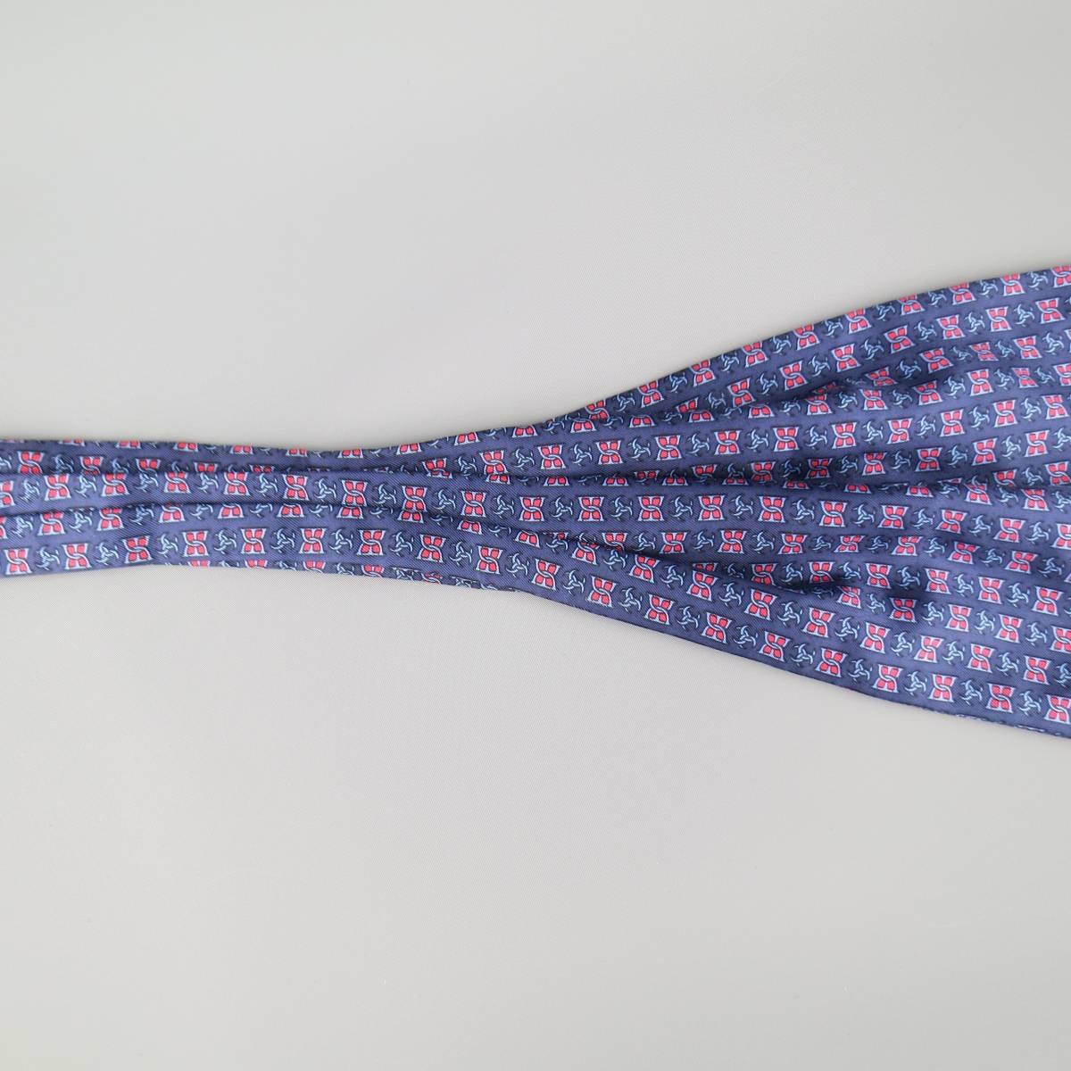 Vintage HERMES navy silk ascot, features a red a blue symbol print. Made in France.
 
Good Pre-Owned Condition.
 
Measurements:
 
Length: 46 In.
Width: 6.65 in.