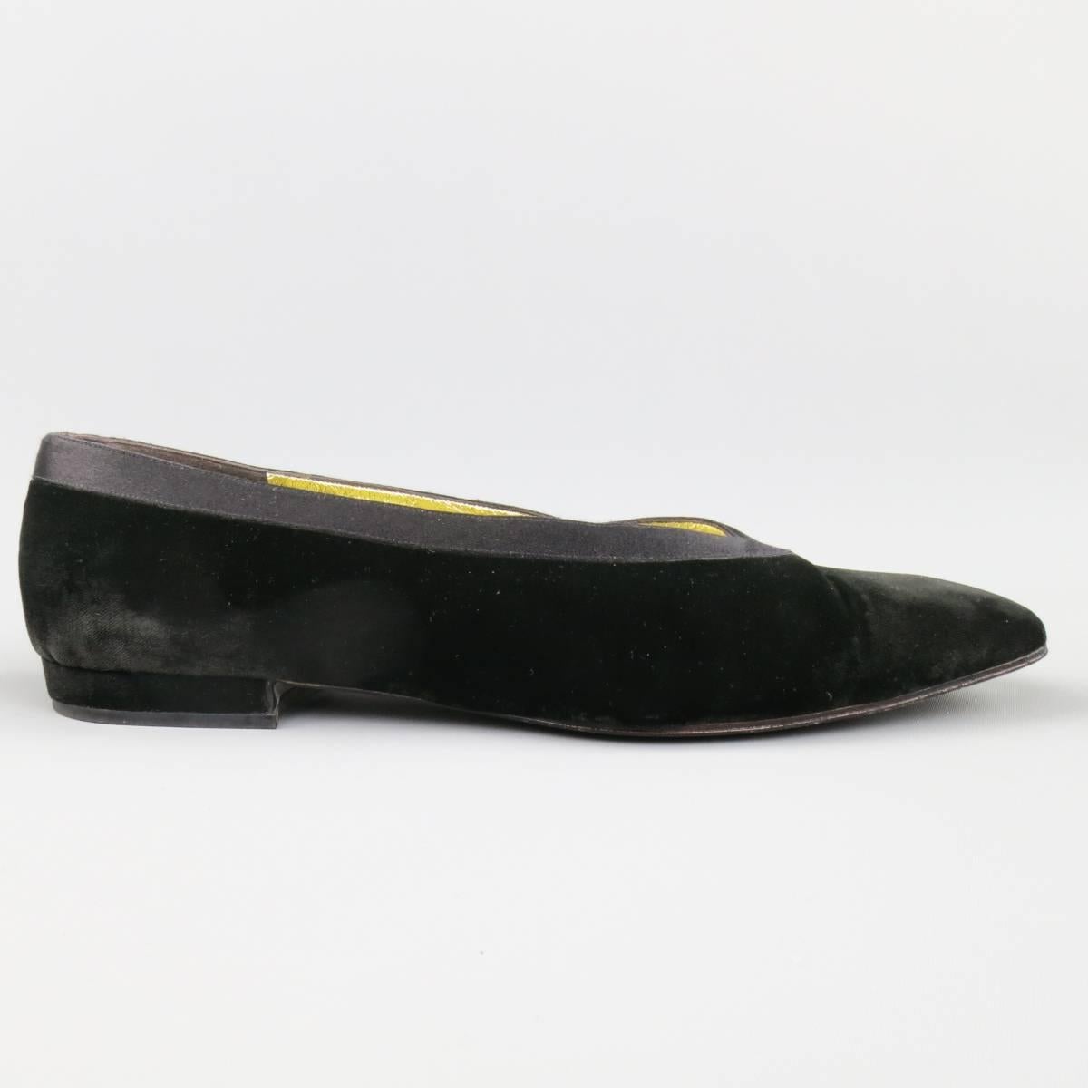 Vintage CHANEL flats in a black velvet featuring a squared off pointed toe, low velvet heel, silk tuxedo stripe round top line, and metallic gold liner. Minor wear throughout. Made in Italy.
 
Good Pre-Owned Condition.
Marked: IT 36.5
 
Heel: 0.5