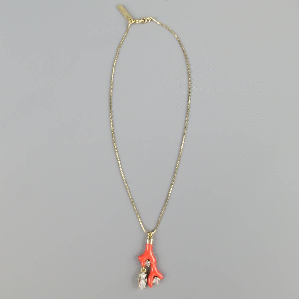 OSCAR DE LA RENTA necklace features a coral and rhinestone pendent with gold accents on a thin, gold colored chain. Features a lobster claw closure with Oscar De La Renta pendent. Includes dust bag and box. Made in USA.
 
Excellent Pre-Owned