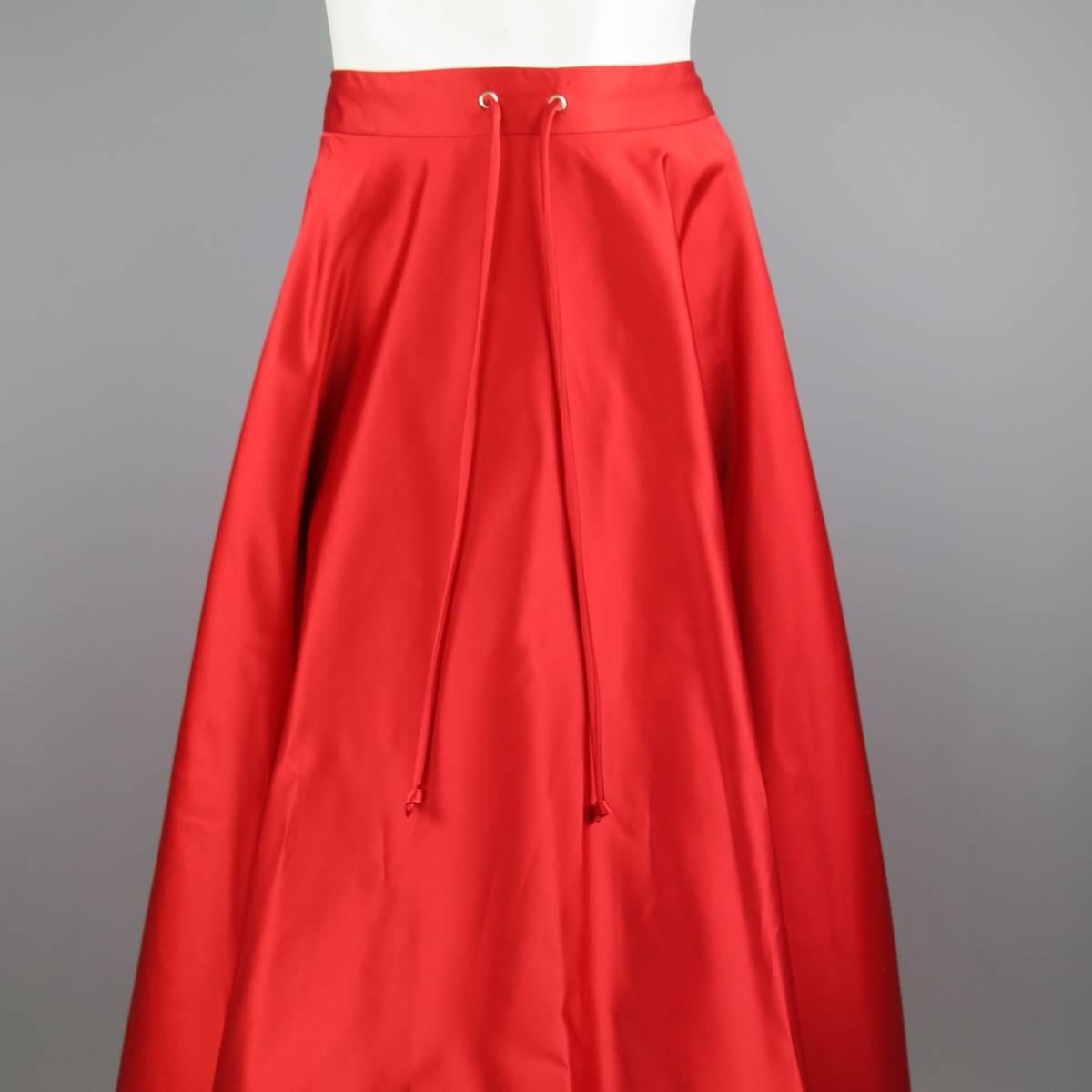 RALPH LAUREN COLLECTION red silk satin evening skirt features a drawstring tie in the front, zipper with hook and eye closure in the back. Minor imperfections. As-Is. Made in USA. Retails at $2999.00.
 
Good Pre-Owned Condition.
Marked: 8
