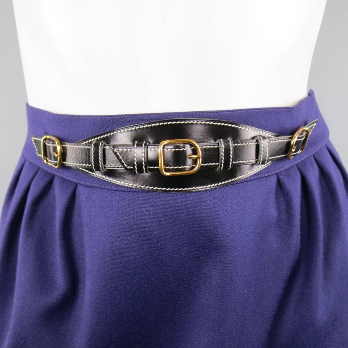 Vintage HERMES pencil skirt in a purple wool featuring a thick waistband with detachable frontal belt detail with gold tone hardware and contrast stitching. Made in France.
 
Excellent Pre-Owned Condition.
Marked: FR 38
 
Measurements:
 
Waist: 27