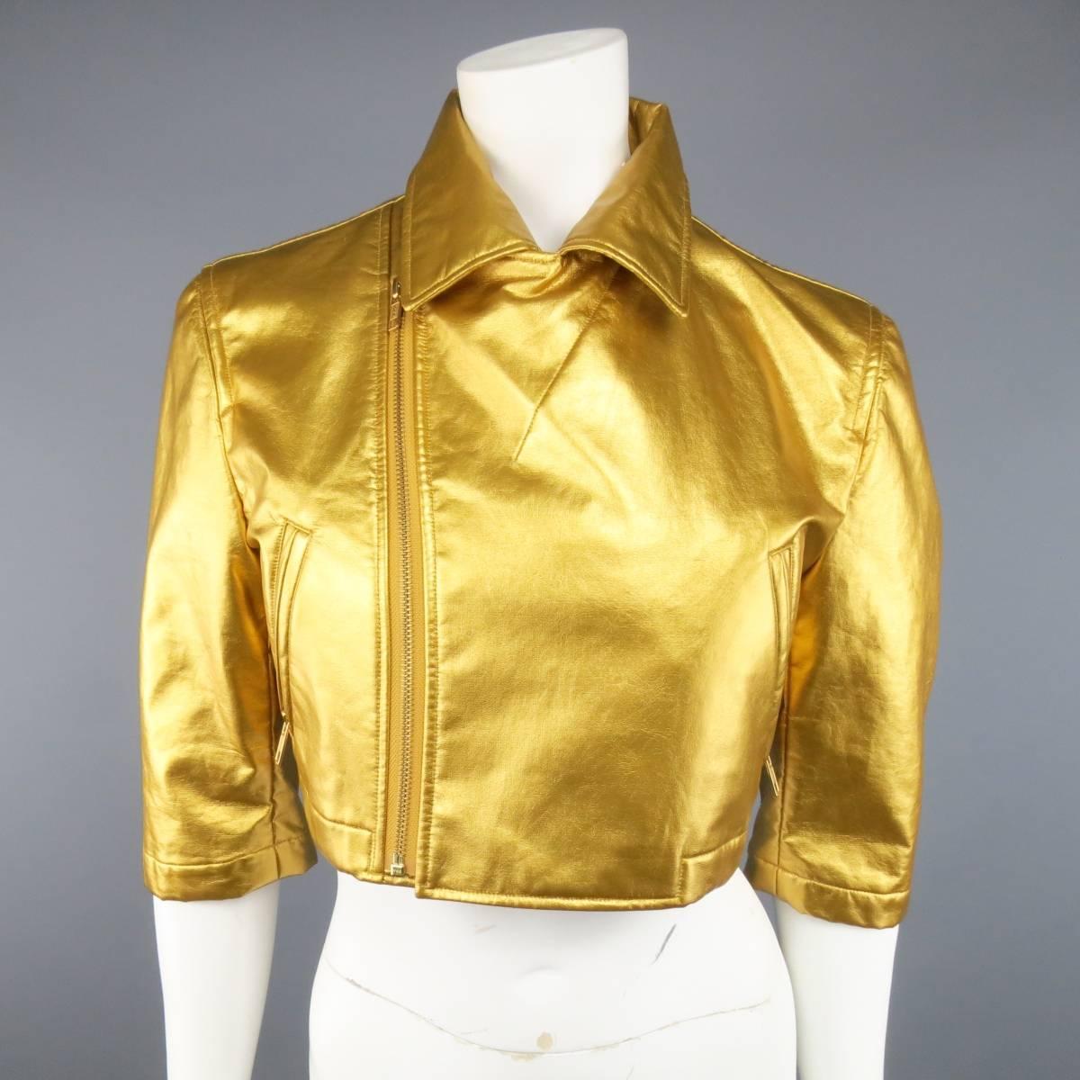 COMME DES GARCONS cropped biker style jacket in a metallic yellow gold vegan leather featuring a pointed collar with asymmetrical zip closure, slanted zip pockets, and three-quarter sleeves with zip opening. Tag Ripped and small imperfection on