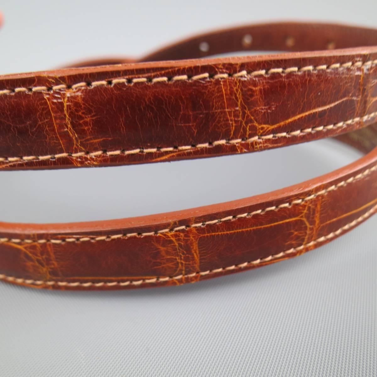 Vintage KIESELSTEIN-CORD belt strap in tan alligator leather with snap closure.
 
Excellent Pre-Owned Condition.
 
Measurements:
 
Length: 41.5 in.
Width: 0.60 in.