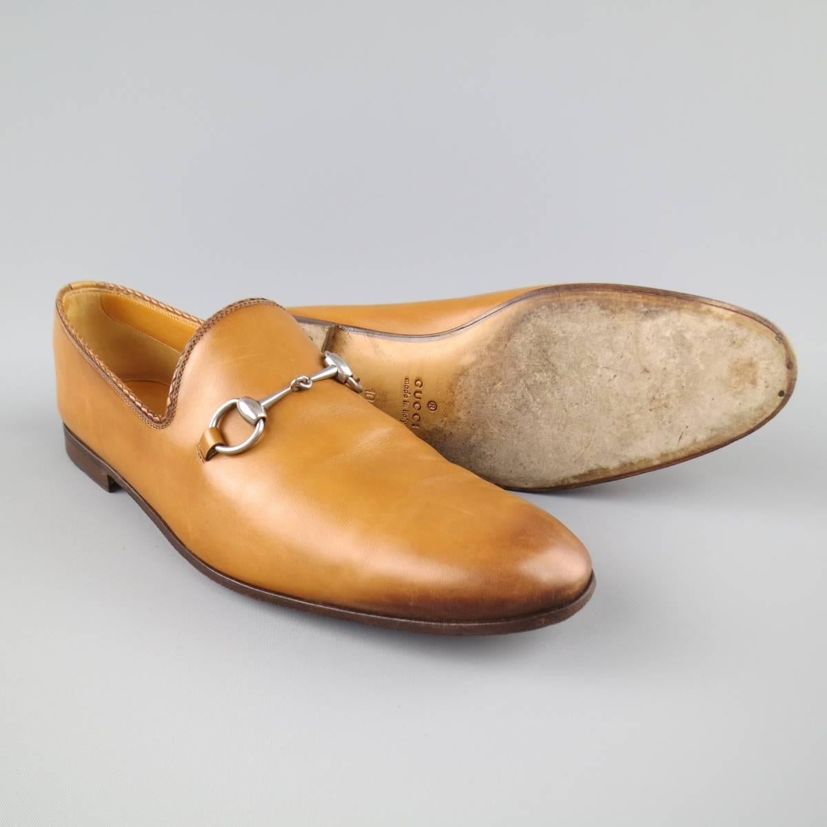 GUCCI loafers in a smooth tan leather featuring a brown ombre tip dye effect, braided piping, and silver tone horsebit detail. Wear throughout. With box  and shoe trees. Made in Italy.
 
Good Pre-Owned Condition.
Marked: UK 10