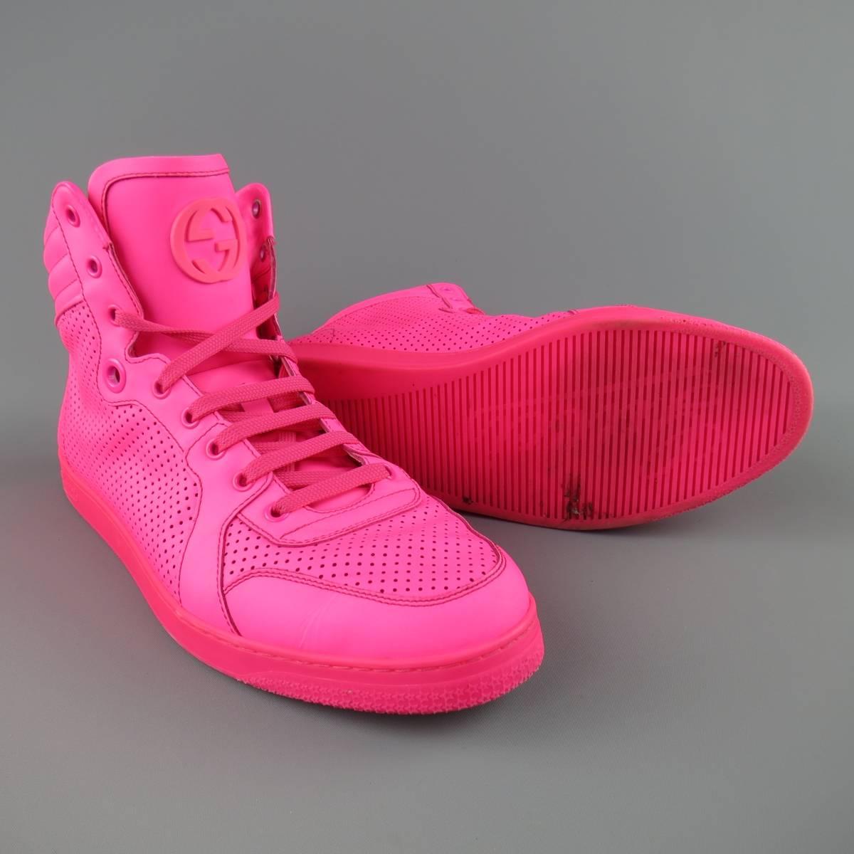 GUCCI high top Sneakers consists of leather material in a neon pink color tone. Designed in a perforated pattern, tone-on-tone stitching with rubber sole. Comes with original box and dust bag. Made in Italy.
 
Excellent Pre-Owned Condition. Retails