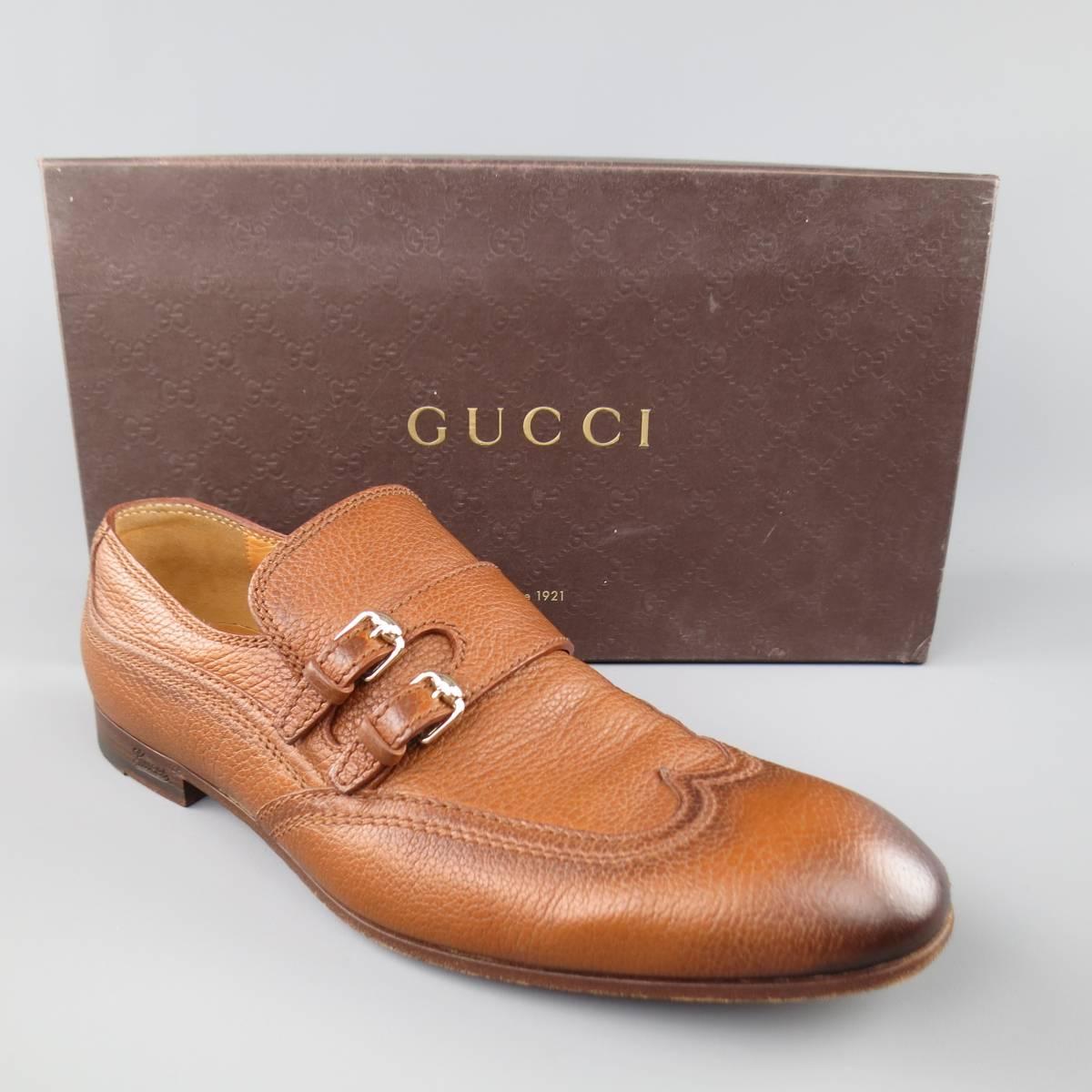 GUCCI Loafers consists of leather material in a tan color tone. Designed in a double monk-strap with silver buckles. Tone-on-tone stitching, burnish color pattern. Leather lining and sole. Comes with original box and cloth bag. Made in Italy.
 
Good
